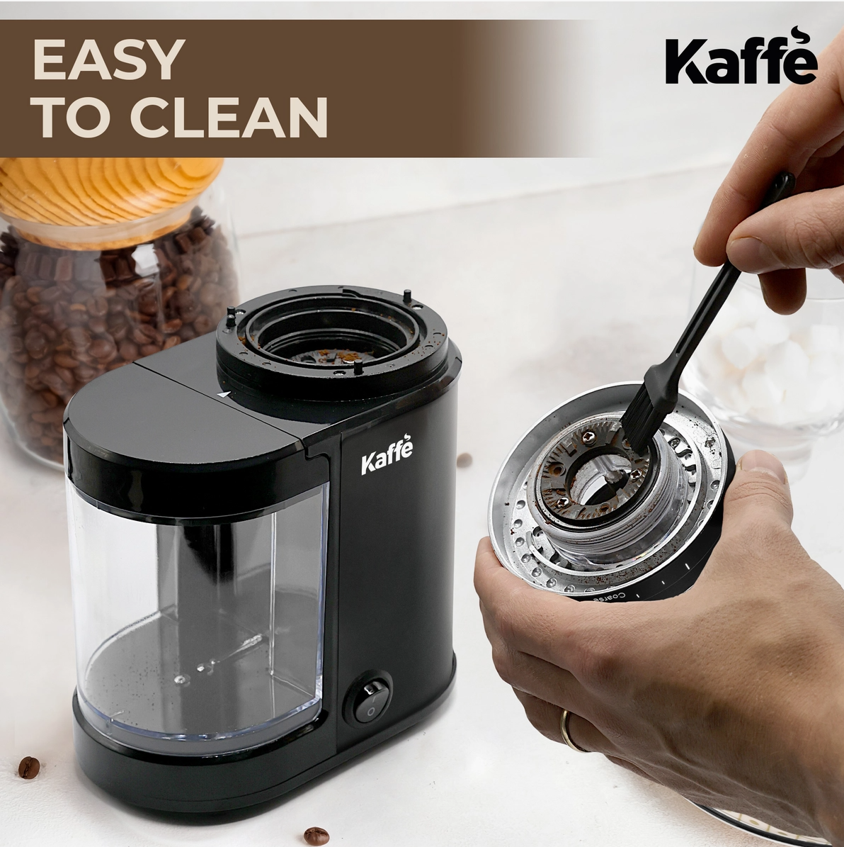 Kaffe coffee grinder with a hand cleaning it, labeled 'Easy to Clean'.