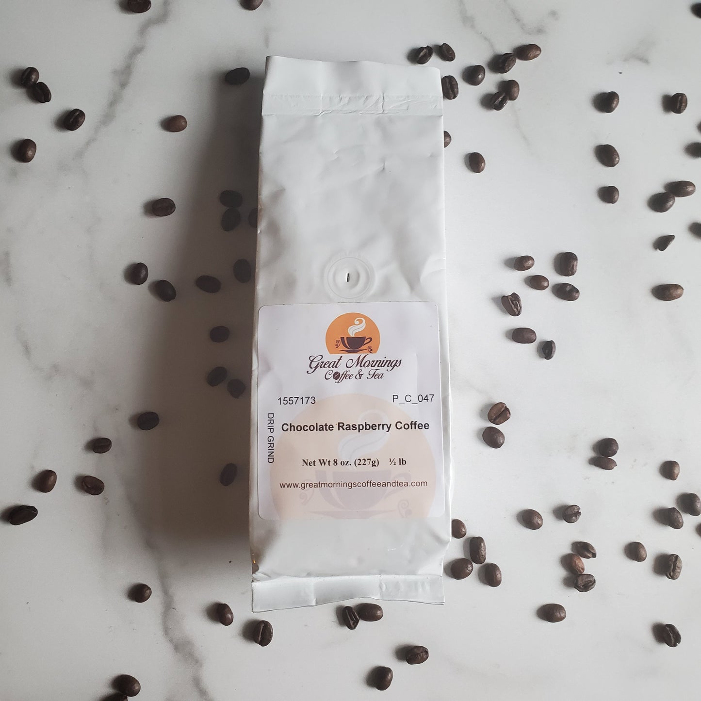 Coffee Bag on marble background with coffee beans